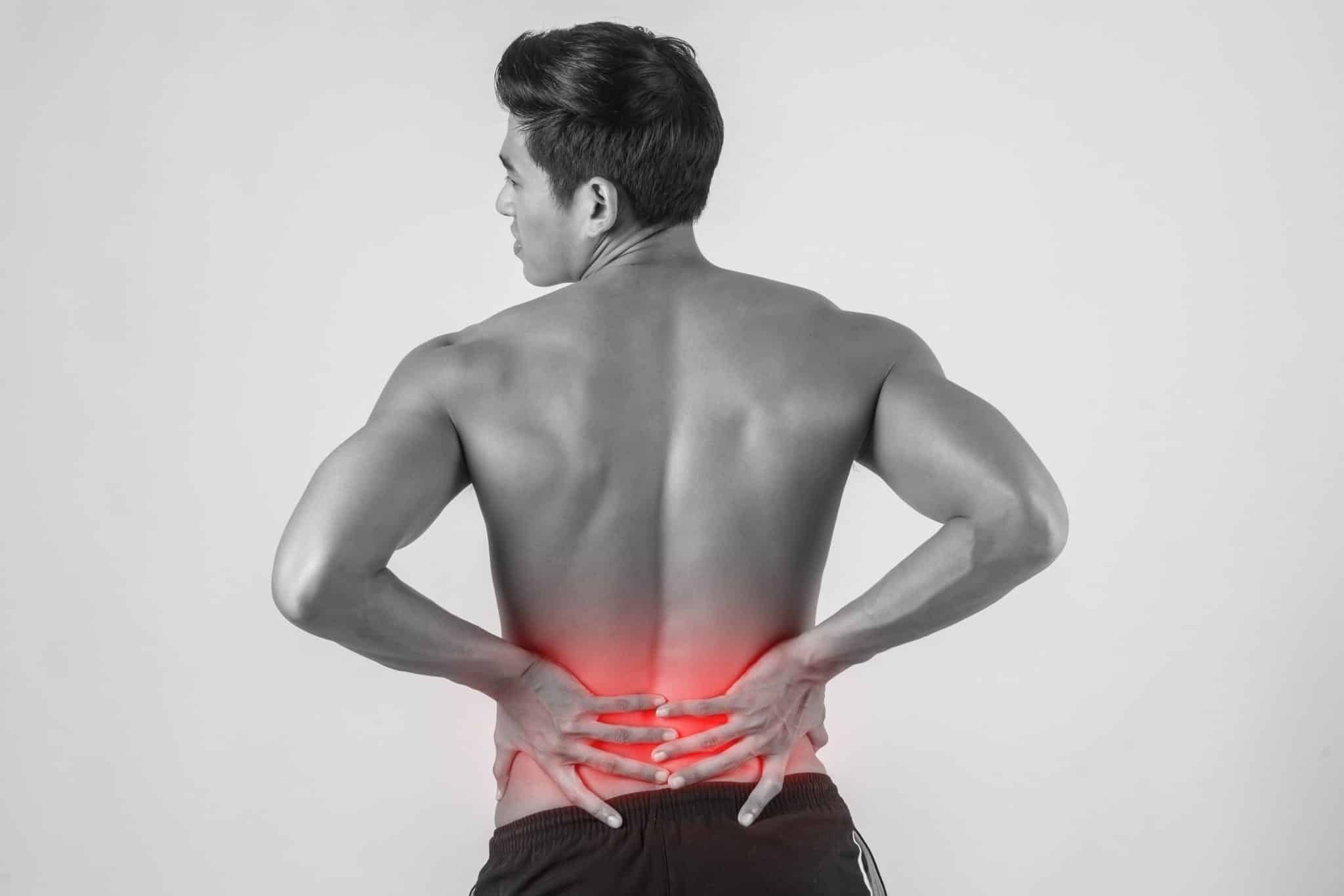 close up man rubbing his painful back isolated white background